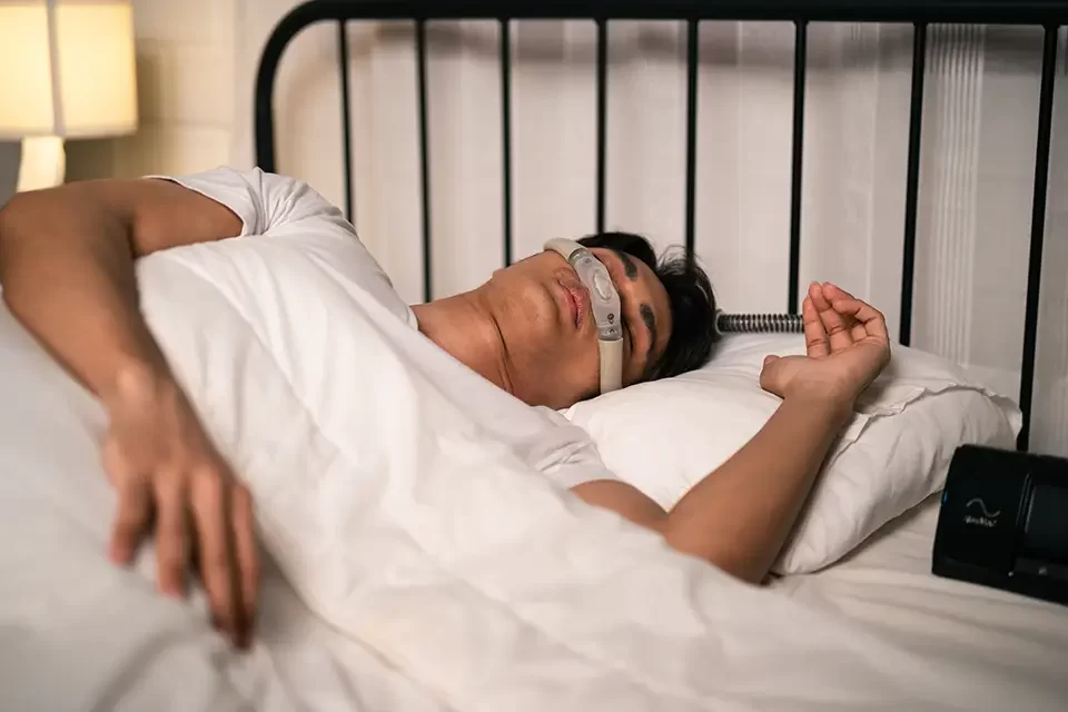 asian-man-wearing-cpap-machine-sleeping-smoothly