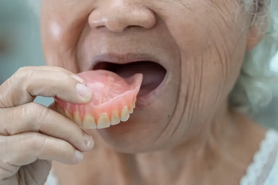 asian-senior-woman-patient-holding-to-use-denture