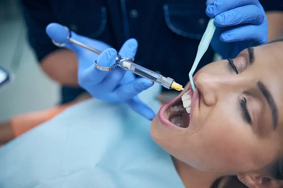 dentist-doing-injection-in-woman-gum-in-office The Most Common Types of Dental Fillings