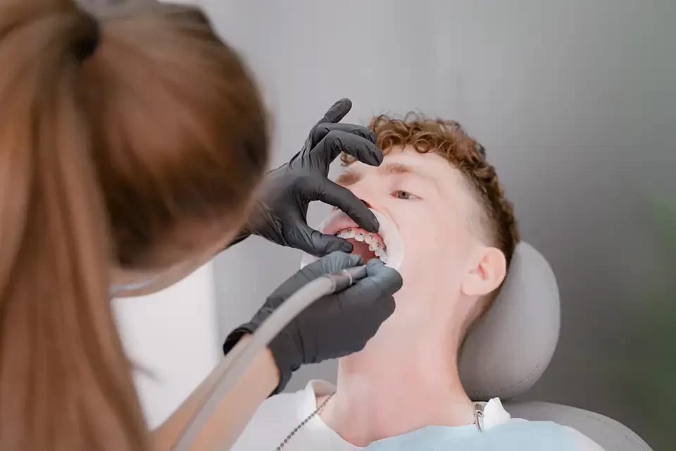 doctor-drills-teeth Common Impacted Wisdom Teeth Symptoms
