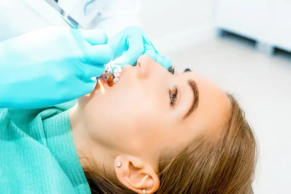 female-dentist-checking-up-patient-teeth Which Type of Dental Filling Is Right for You?