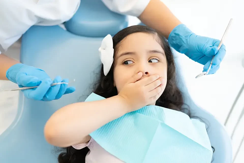 girl-scared-during-checkup-at-dental-clinic