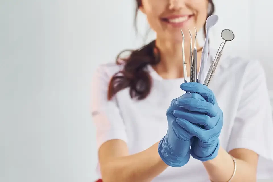 portrait-of-professional-female-dentist-with-equip Importance of Dental Diagnostic Tools